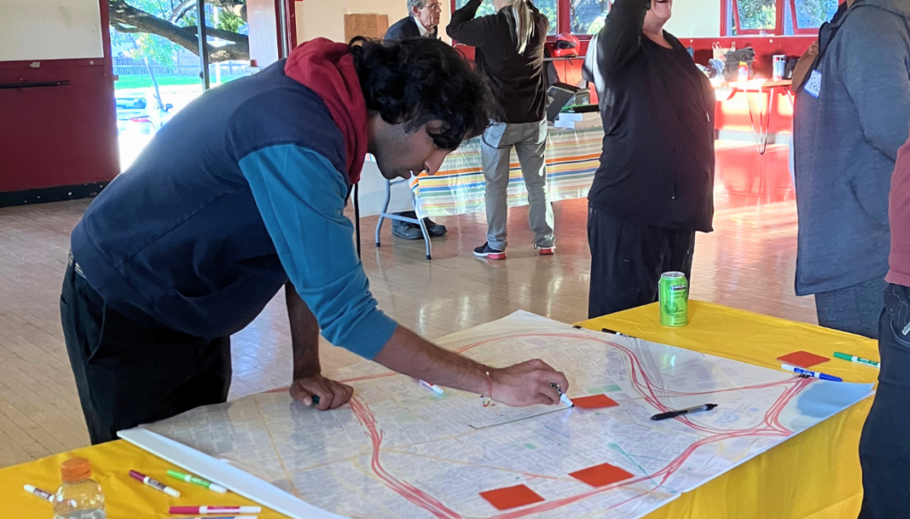 A person studies a map of West Oakland